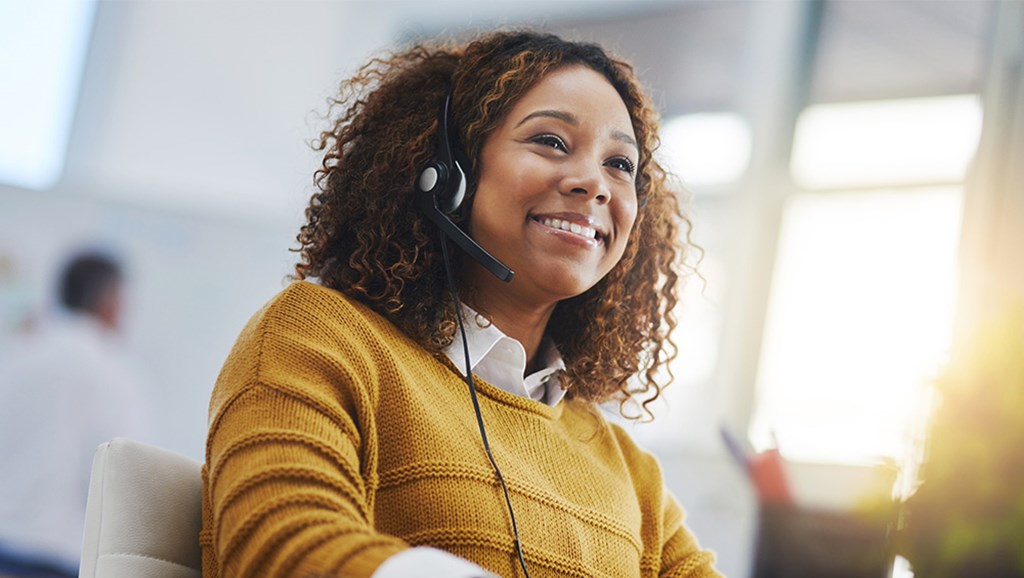 Woman with headset on smiling 